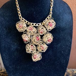 Gold tone nesting stone necklace